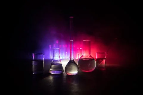 Test glass flask with solution in research laboratory. Science and medical ba Stock Photos