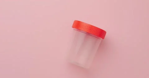 Test jar on a pink background Stock Footage 146481108
