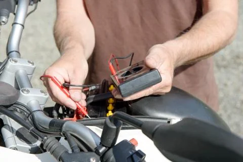 Test of the motorcycle battery Stock Photos