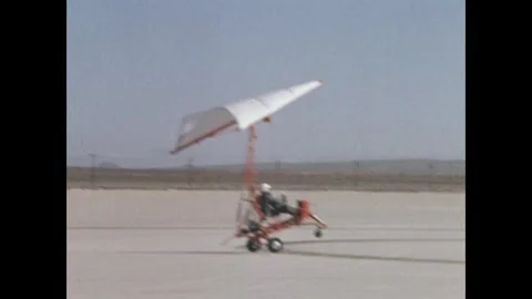 Test pilot and astronaut Neil Armstrong taking off in paraglider Stock Footage 269506489