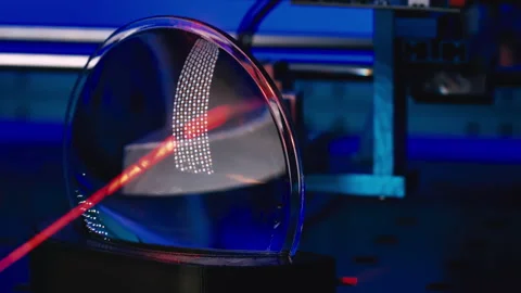 Test of a plastic lens for an optical device using a laser in an optics labor Stock Footage 160900014