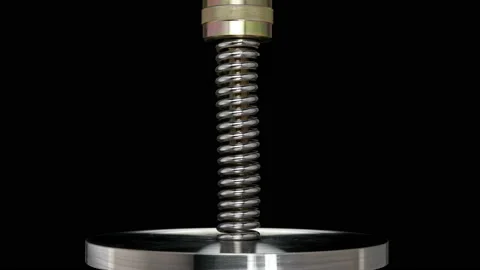 Test of reliability of a spring, compression and decompression by a hydraulic Stock Footage 95201066