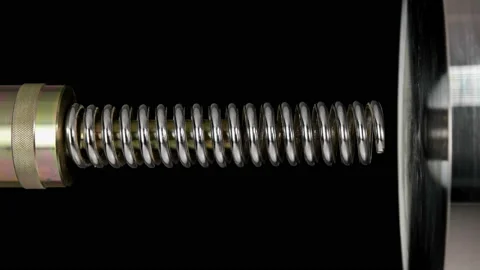 Test of reliability of a spring, compression and decompression by a hydraulic Stock Footage 95212951