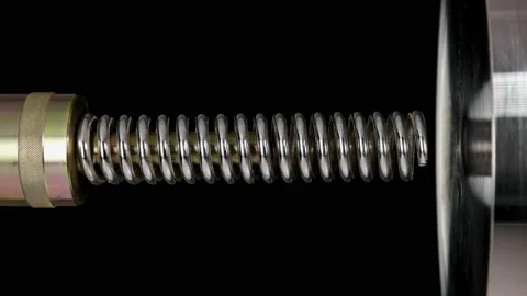 Test of reliability of a spring, compression and decompression by a hydraulic Stock Footage 95215375