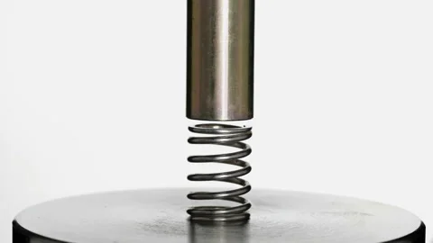 Test of reliability of a spring, compression and decompression by a hydraulic Stock Footage 95216545