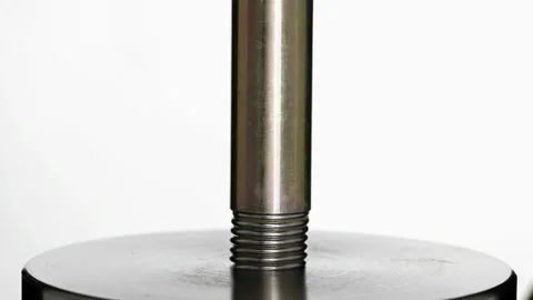 Test of reliability of a spring, compression and decompression by a hydraulic Stock Footage 95217181