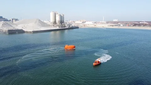 Test run a fast rescue craft and a life boat Stock Footage 116490764