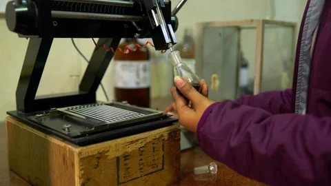 Test sample of bitumen is being prepared and testing in materials lab Stock Footage 329211351