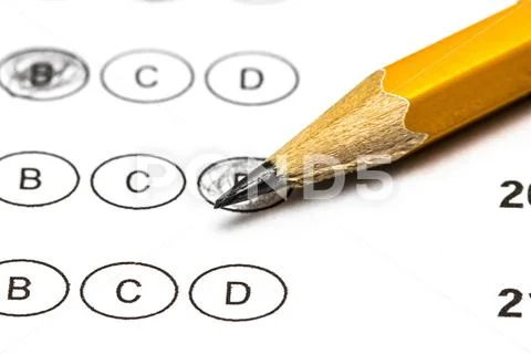 Test score sheet with answers and pencil . Closeup. Stock Photos