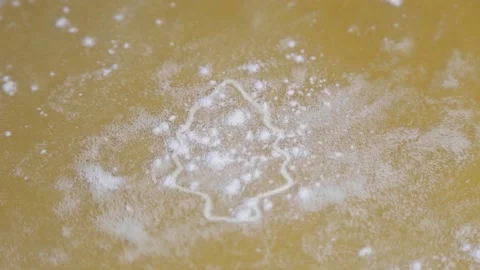 The test shows a Christmas tree cut out with a mold, which is sprinkled with Stock Footage 169223685