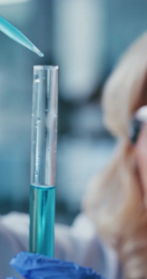Test tube, analysis and scientist with pipette in lab, exam or medical research Stock Footage 331337573