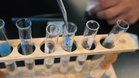 Test Tube Being Filled with Material Stock Footage 310735062