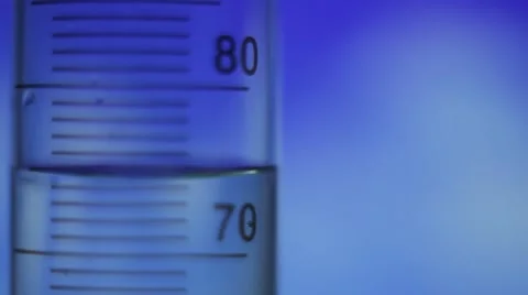 Test tube on a blue background Stock Footage 54614294