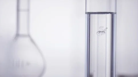 Test tube get filled with viscous liqud Video stock 100558401