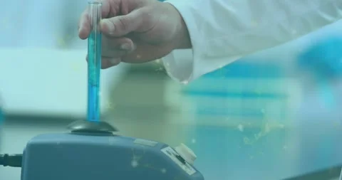 Test tube lowering causing lab hand seating tube on rotor, agitating blue Stock Footage 330444408