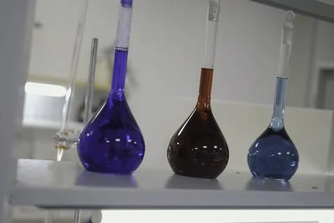 Test tubes and flasks with multi colored liquids in the laboratory. Chemica.. Stock Photos