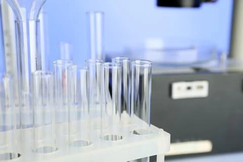 Test tubes and microscope in laboratory Stockfoto's