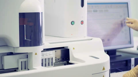 Test tubes are being processed by a modern laboratory machine Stock Footage 87819448