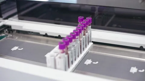 Test tubes are getting inserted into automation blood analyzer	 Stock Footage 133444816