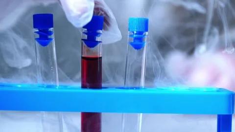 Test tubes with blood sample in dry ice Stock Footage 305650846