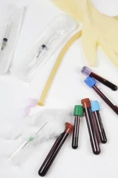 Test tubes with blood samples and with how many and syringe Stock Photos