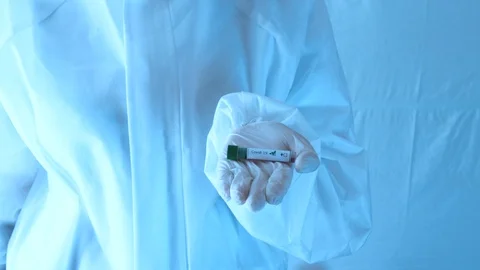 Test tubes with blood samples in doctor's hands. Covid-19 test tubes Stock Footage 130153936
