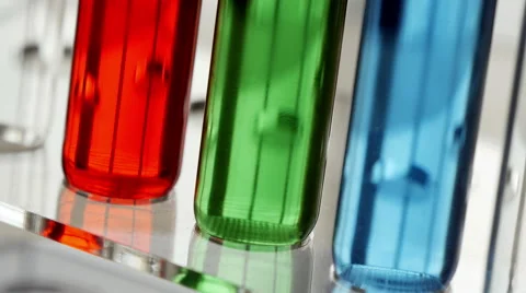 Test tubes with colored liquid rotating CU, 4k, UHD Stock-Footage 49999619