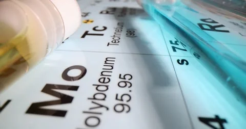 Test tubes with different liquids on the periodic table of chemical elements Stock Footage 262796165