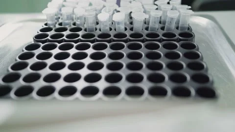 Test tubes with DNA samples. Saliva tubes for coronavirus testing. Stock Footage 155012991