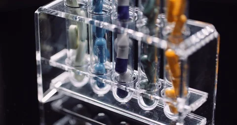 Test Tubes Filled with Pills and Drugs Stock Footage 128332568