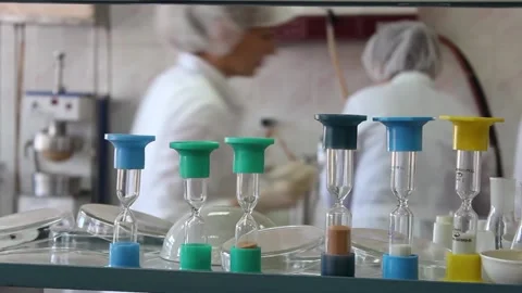 Test tubes, flasks, hourglasses, laboratory utensils against Stock Footage 128374551