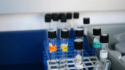 Test tubes labeled with color coded tape containing various chemicals Stock Footage 101069728