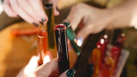 Test tubes with multi-colored liquid. Alcohol in test tubes dark bar Stock Photos