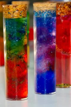 Test tubes with multi-colored liquid inside Stock Photos
