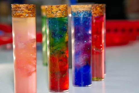 Test tubes with multi-colored liquid inside Stock Photos