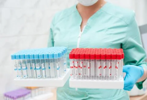 Test tubes in nurses hands Stock Photos