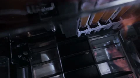Test tubes with plasma inside the Biochemical laboratory blood analyzer Stock-Footage 197058120