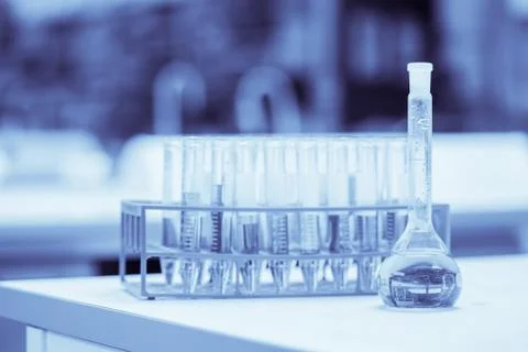 Test tubes in rack containing liquid Stock Photos
