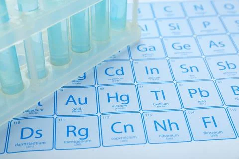 Test tubes in rack on periodic table of chemical elements, closeup 스톡 사진