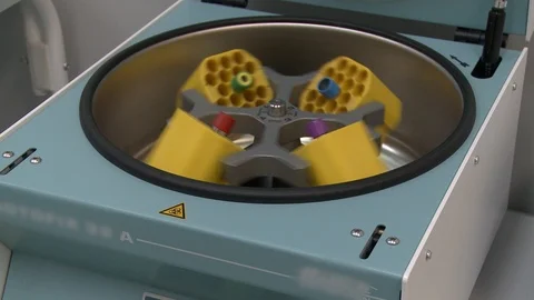 Test tubes rotating in cetrifuge for analysis video Video stock 107928634