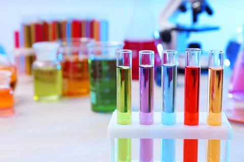 Test tubes with samples in rack on table, closeup and space for text. Solutio Stock Photos