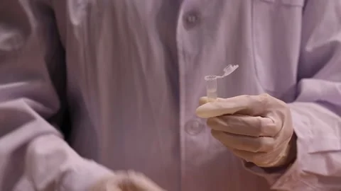 Tester experimenter tube sampling (2) Stock Footage 202235496