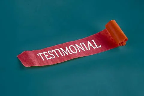 TESTIMONIAL word on a piece of an unfolded note Stock Photos