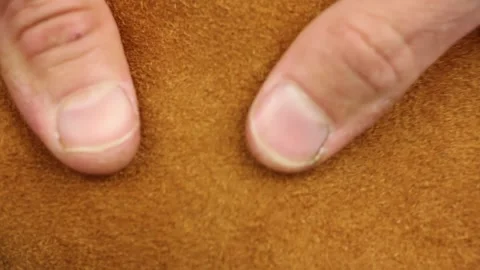 Testing and rumples piece of seamy side brown natural leather, closeup view Stockbeeldmateriaal 135290768