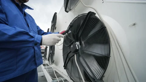 Testing with an anemometer of an axial fan of the condensing unit Stock Footage 157392533