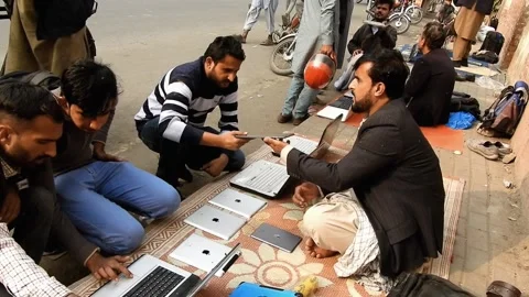 Testing Apple Ipad In Roadside Market Lahore, Pakistan Stock Footage 227485735