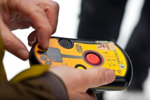 Testing an avalanche beacon before heading into the backcountry. Monashees, Stock Photos
