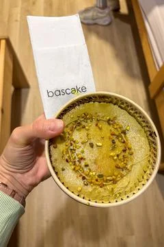 Testing Basque cheesecake in Bascake café in Bilbao, Spain Stock Photos