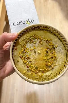 Testing Basque cheesecake in Bascake café in Bilbao, Spain Stock Photos