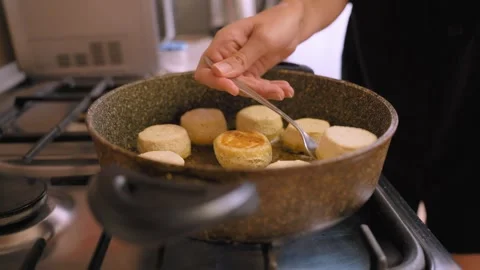 Testing burger doneness carefully. Using fork to check meat thoroughly Stock Footage 329061422
